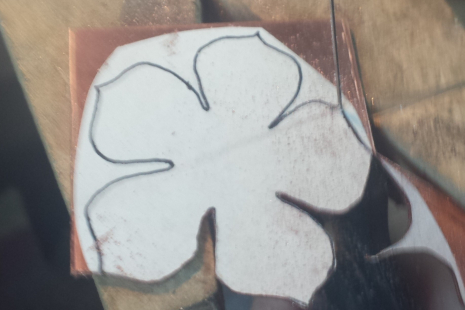 One stage in making the copper flower pendant